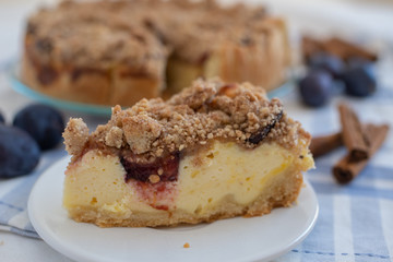 Fresh plum cheesecake with cinnamon and almond crumble