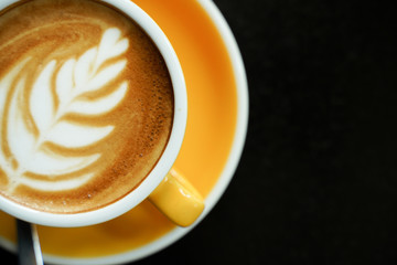 Coffee Latte leaf pattern face on black table