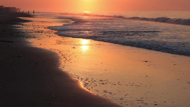 Beautiful sunrise, waves, and ocean scenery at Topsail Beach, a vacation community by the Atlantic ocean in North Carolina, USA