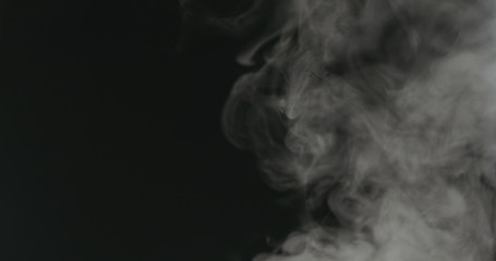 water mist over black background