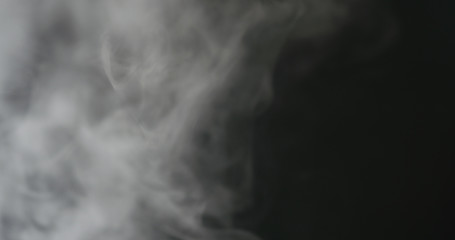 water mist over black background