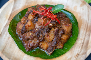 Indonesian dish - fried meat in chili sauce, closeup
