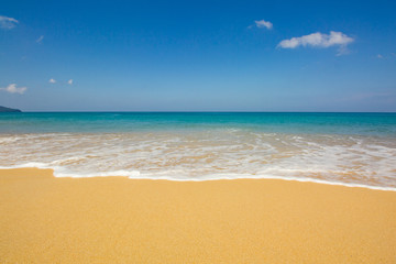 Fototapeta na wymiar tropical beach and sea with blue sky at Mai Khao beach in Phuket, Thailand