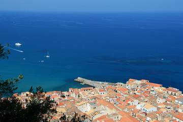 Naklejka premium View of Cefalu town from the rock of Rocca di Cefalu in the morning. Sicily, Italy