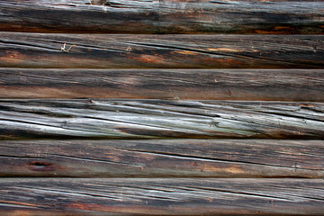 Fototapeta premium Wall made of old logs natural wood. Natural wood texture pattern. Natural wood cladding