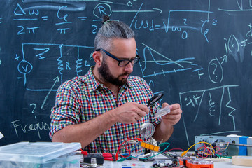 Tech postgraduate student working on electronic project