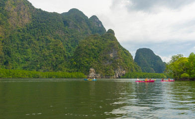Fototapeta na wymiar Group of tourists kayaking at Ao tha lane, Krabi, Thailand