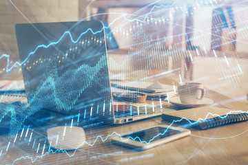 Double exposure of forex chart and work space with computer. Concept of international online trading.