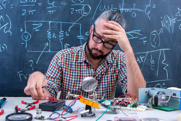 Tech postgraduate student working on electronic project