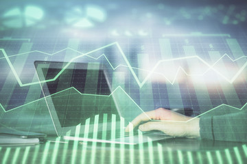 Multi exposure closeup hands with stock market forex graph. Concept of research and analysis.