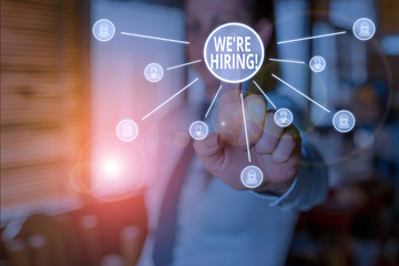 Conceptual hand writing showing We Re Hiring. Concept meaning recently employ someone or pay...