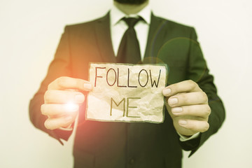 Writing note showing Follow Me. Business concept for Inviting a demonstrating or group to obey your...