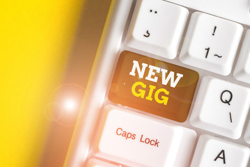 Text sign showing New Gig. Business photo text getting job Attending live Concert Gigabyte Freelancer offer White pc keyboard with empty note paper above white background key copy space