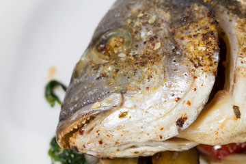 Head of baked dorado fish.