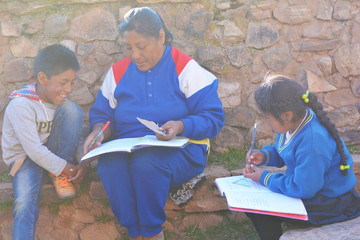 Native american woman teaching kids.