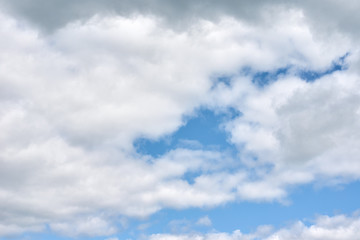Naklejka na ściany i meble Blue sky with a white clouds, abstract background