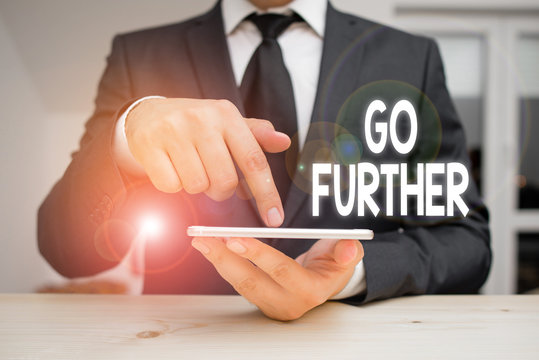 Writing note showing Go Further. Business concept for To move to a greater distance or overcome your limitations