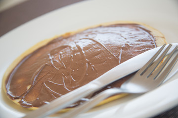 Pancake with chocolate on it.