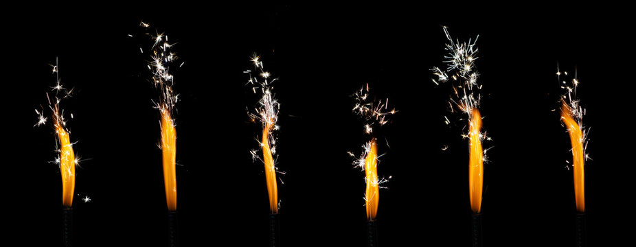 Burning roman candles isolated on black background. Pyrotechnics, firework sparkler
