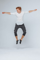 man jumping on a light background