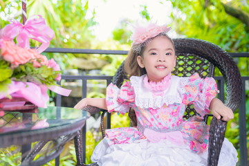 Little girl Wearing a lolita dress In the garden
