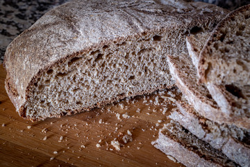 Traditionally baked oven bread on cutting table. Traditional Turkish Kula (historical site in Manisa) Bread.