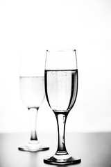 monochrome photo of champagne on white table on white background isolate