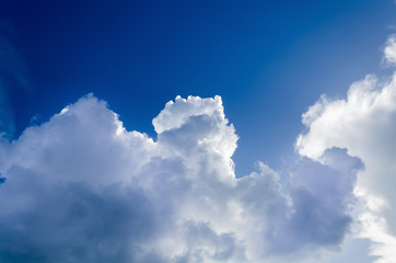 Naklejka na ściany i meble Beautiful white clouds in clear blue sky