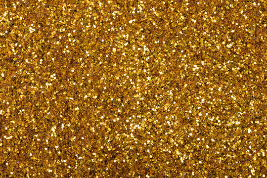 Superlative gold glitter background, your new stylish texture for perfect design look.