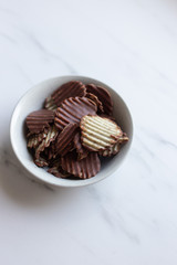 Japanese chocolate potato chips on a marble background with copy space
