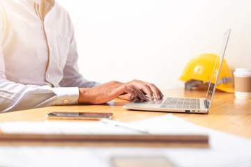 Asian businessman hands on the keyboard Working at home office with laptop,Data Processing business...