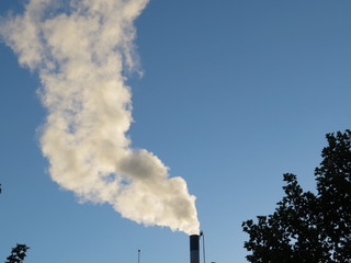 Fireplace releasing large quantities of smoke lost in the atmosphere