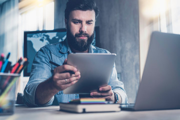 Digital industry professional upgrading new version of corporate software at his workplace. Young...
