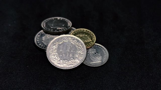 Swiss Franc Coins Turning on Black - CHF.mp4
