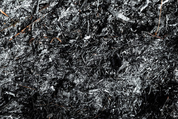 Gray background ashes, burned plants, abstract texture of coals and ashes. Macro shot.