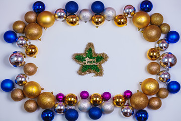 Gold, blue and silver glitter Christmas balls pattern. Flat lay, top view, copy space. Christmas golden, blue and silver balls decorations on white background. New year creative arrangement frame.