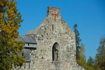 Fototapeta premium City Sigulda, Latvia Republic. Old castle from build rocks and tree with yellow leafs. 27. Sep. 2019