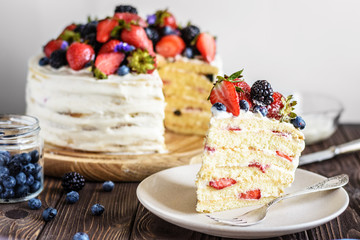 Rustic Cake With Fresh Berries on a wooden background