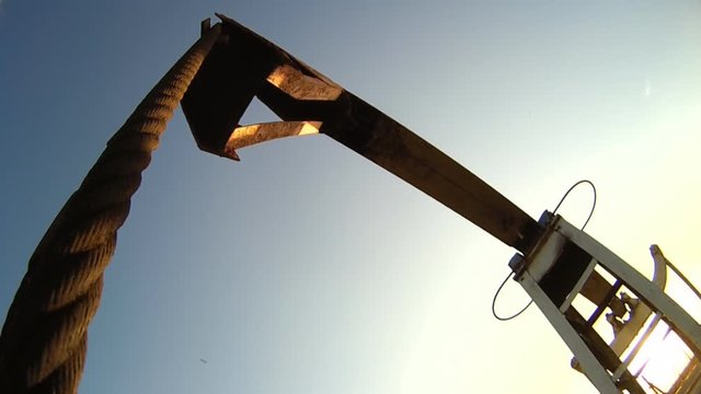 Close-up of balancing the drive rod pumps oil rocker. Oil pumps. Oil industry equipment