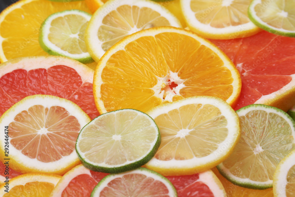 Poster Mix of citrus fruits cut in slices