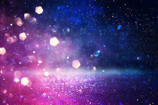 abstract glitter pink, purple and blue lights background. de-focused