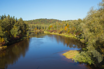 Fototapeta na wymiar City Sigulda, Latvia Republic. River and wood valley in Autumn. 27. Sep. 2019