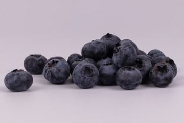 Close front view of juicy organic harvest of berries blueberries
