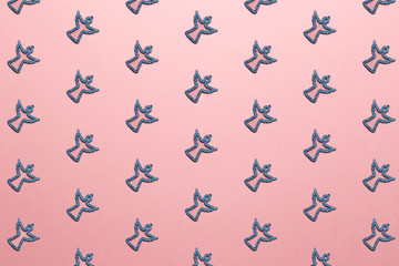 New Year concept. Trendy pattern made with Christmas toy tree on bright light pink background. Minimal creative concept. Creative Christmas decoration. Pastel colors