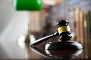 Lawyer concept. Gavel on the bookshelf background.