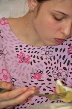 girl eats dumplings. Ukrainian national cuisine. Vfrtniki and pelm