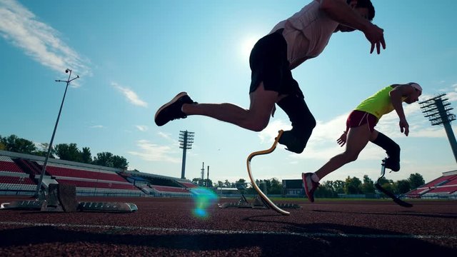 Paralympians with artificial legs are practicing in running