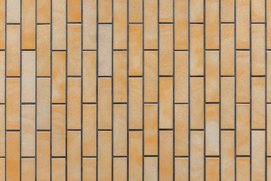 Seamless orange mossaic tiles texture. Architecture material constuction.