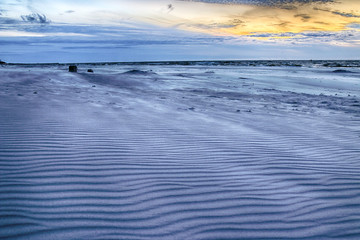 Baltic Sea and beautiful sunset on the beach in Slowinski National Park near Leba, Poland. Wild,...