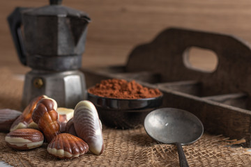 Famous Belgian Chocolate seafood on a table with a cup of coffee